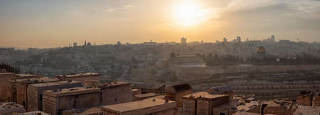 Jerusalem, Israel - April 4, 2019: Beautiful view of the Old City, Tomb of the Prophets and Dome of the Rock during a sunny and cloudy sunset.のeditorial素材