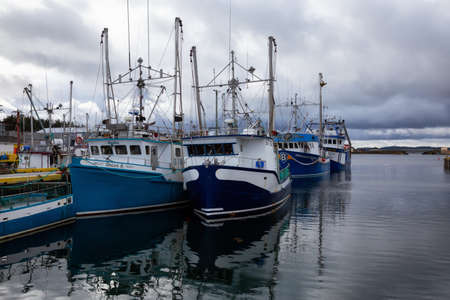 Twillingate, Newfoundland, Canada - October 15, 2018: Fishing boats parked at a marina during a cloudy morning.のeditorial素材