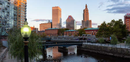 Downtown Providence, Rhode Island, United States - October 25, 2018: Panoramic view of a modern cityscape during a vibrant sunset.のeditorial素材