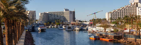 Eilat, Israel - April 10, 2019: Aerial panoramic view of a marina in the downtown city during a...