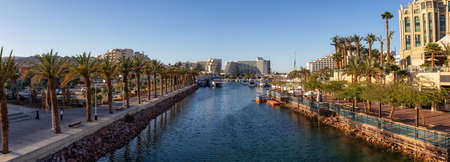Eilat, Israel - April 10, 2019: Aerial panoramic view of a marina in the downtown city during a sunny sunset.のeditorial素材