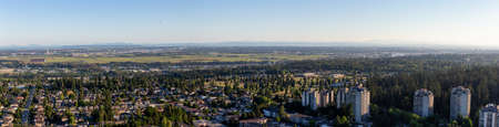 Aerial view of a residential suburban neighborhood during a sunny summer evening. Taken in Burnaby, Vancouver, BC, Canada.の写真素材