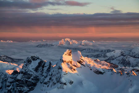 Aerial view of a beautiful Canadian Landscape during a winter sunset. Taken near Squamish, North of...