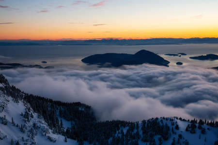 Aerial view of a beautiful Canadian Landscape during a winter sunset. Taken in Howe Sound, North of Vancouver, British Columbia, Canada.の写真素材