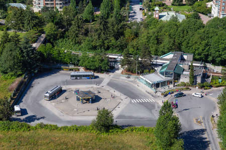 Burnaby, Greater Vancouver, BC, Canada - July 4, 2018: Aerial view of a skytrain station and a bus...