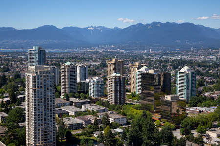 Burnaby, Vancouver, BC, Canada - July 12, 2018: Aerial view of a modern city during a vibrant sunny summer evening.のeditorial素材