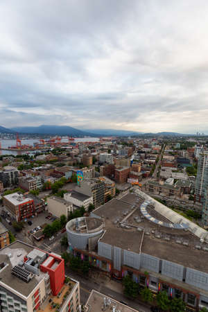 Downtown Vancouver, British Columbia, Canada - June 22, 2018: Aerial view of the modern city during a cloudy sunset.のeditorial素材
