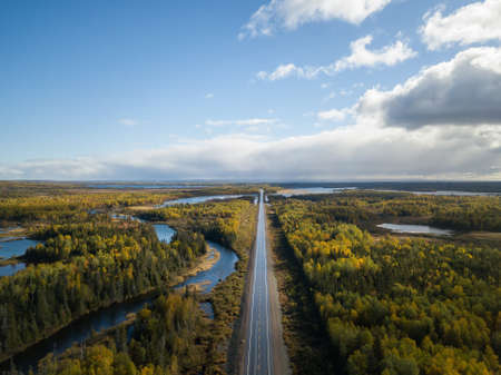 Aerial view of a scenic road during a beautiful sunny day in the Autumn. Taken near Grand...