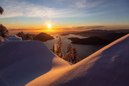 Beautiful Canadian Landscape view during a colorful winter sunset. Taken from top of Mnt Harvey, North of Vancouver, BC, Canada.の写真素材
