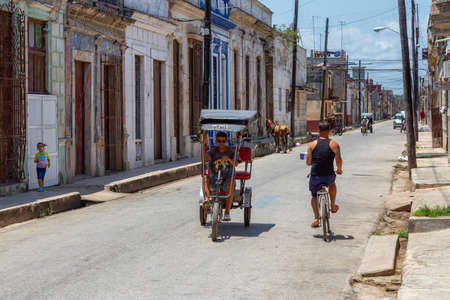Cardenas, Cuba - May 11, 2018: Street view of an Old Cuban Town near Varadero during a sunny day.