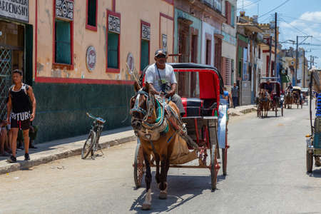 Cardenas, Cuba - May 11, 2018: Horse Carriage riding in the streets of an Old Cuban Town near Varadero during a sunny day.のeditorial素材