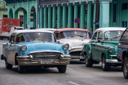 Havana, Cuba - May 16, 2019: Classic Old Taxi Car in the street during a vibrant and bright sunny...