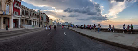 Havana, Cuba - May 12, 2019: Beautiful panoramic view of the Old Havana City by the Ocean Coast during a vibrant sunny and cloudy sunset.のeditorial素材