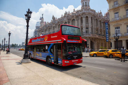 Havana, Cuba - May 19, 2019: Touristic Bus Tour, Hop on Hop Off, in the streets of the Old Havana City during a vibrant and bright sunny day.のeditorial素材