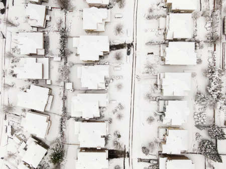 Aerial View from Above of a Residential Neighborhood with homes and trees covered in white after a big snow storm in the Lower Mainland. Taken in Coquitlam, Vancouver, BC, Canada.の写真素材