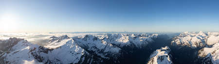 Aerial Panoramic View of Remote Canadian Mountain Landscape during sunny sunrise. Located near...