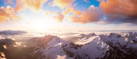 Aerial Panoramic View of Remote Canadian Mountain Landscape. Sunset or Sunrise Sky Composite....
