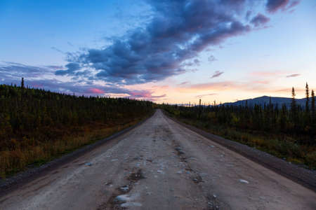 View of Scenic Road leading to Tombstone at Sunrise in Canadian Nature. Dempster Highway, Yukon, Canada.の写真素材