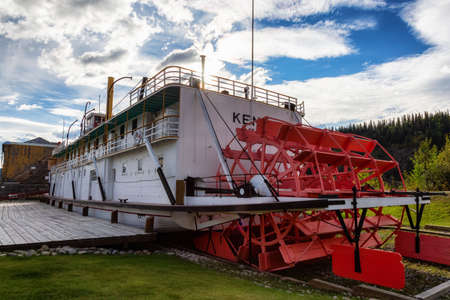 Dawson City, Yukon, Canada - August 27, 2020: Historic Boat Memorial, Keno, in the public town park during a cloudy summer day.のeditorial素材
