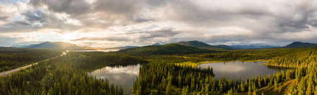 Stunning Panoramic View of Serene Lakes surrounded by Beautiful Trees in Canadian Nature along Alaska Highway. Aerial Drone Shot. Southern Yukon, Canada.の写真素材