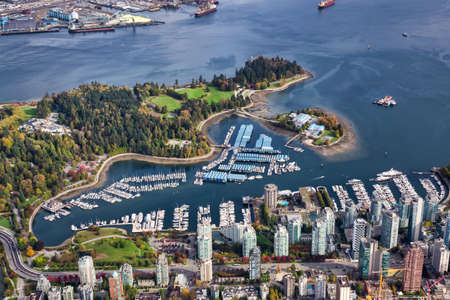 Aerial view of Coal Harbour and a modern Downtown City during a vibrant sunny morning. Taken in Vancouver, British Columbia, Canada.の写真素材