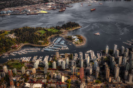 Aerial view of Coal Harbour and a modern Downtown City during a vibrant sunny morning. Taken in Vancouver, British Columbia, Canada.の写真素材