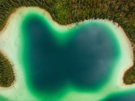 Aerial view of colorful pond in the marshlands during a fall season day. Taken in Yukon, Canada.の写真素材