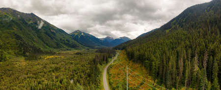Panoramic View of Scenic Road surrounded by Mountains in Canadian Nature.の写真素材