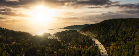 Horseshoe Bay, West Vancouver, British Columbia, Canada. Aerial view of residential homes near the Highway during a bright and sunny sunset in Fall Season.の写真素材