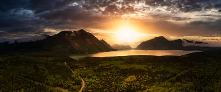 Panoramic View of Scenic Lake surrounded by Forest and Mountains in Canadian Nature. Dramatic...