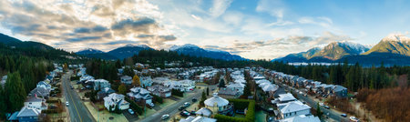 Aerial Panoramic View of Residential Homes in a touristic city. Colorful Sunrise Sky. Taken in...