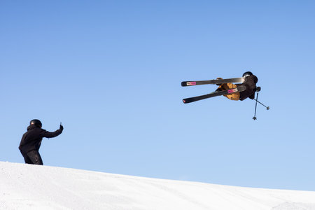 whistler, British Columbia, Canada - Jan 18, 2021: Extreme Skier jumps up high with blue sunny sky in background.のeditorial素材