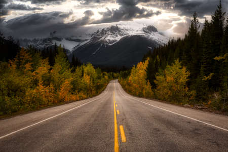 Scenic road in the Canadian Rockies during a vibrant sunny and cloudy summer morning. Artistic...