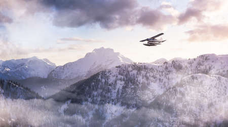 Airplane flying near the Beautiful Canadian Mountain Nature Landscape. Adventure Composite. Dramatic Sunset Sky. Background from near Vancouver, British Columbia, Canada.の写真素材