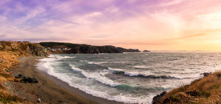 Panoramic view of a small town on the Atlantic Ocean Coast. Colorful Sunset Sky Art Render. Taken in...