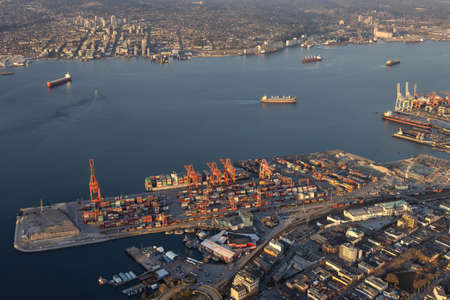 Vancouver, British Columbia, Canada - March 16, 2021: Aerial view from Airplane of Industrial Site,...