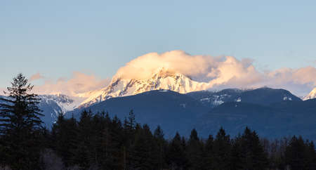 Panoramic View of Canadian Mountain Landscape covered in Clouds. Colorful Sunset Sky. Mt Garibaldi in Squamish, British Columbia, Canada. Nature Background Panoramaの写真素材