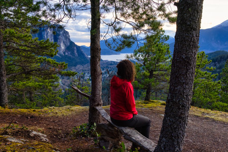 Adventurous Woman Hiking in the mountains during a Spring Sunset. Taken Squamish, North of Vancouver, British Columbia, Canada. Concept: Adventure, freedom, lifestyleの写真素材