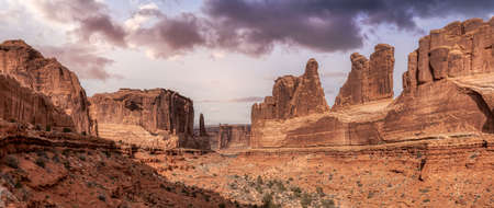 Panoramic American landscape view of Scenic red rock canyons. Artistic Sky Colorful Render. Taken in Arches National Park, located near Moab, Utah, United States. Nature Background Panoramaの写真素材