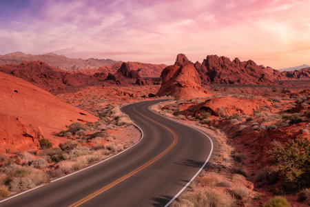 Valley of Fire State Park, Nevada, United States. Scenic road in the desert during a cloudy morning. Dramatic Sunrise Sky Art Render.の写真素材