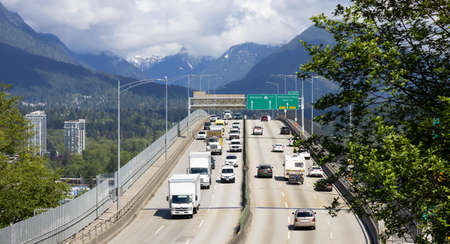 Vancouver, British Columbia, Canada - May 4, 2021: Traffic driving across the Second Narrows Bridge...