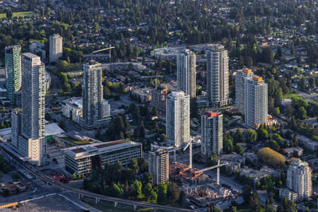 Greater Vancouver, British Columbia, Canada - May 16, 2021: Aerial View from an Airplane of Surrey Central Mall and Residential Homes.のeditorial素材