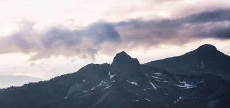 Aerial view from Airplane of the Iconic Mountain, Lions Peak. Colorful Sunset Sky Art Render. Howe Sound, North of Vancouver, British Columbia, Canada.の写真素材