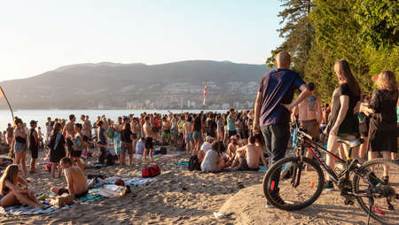 Vancouver, British Columbia, Canada - July 20, 2021: Crowd of People partying at the beach during the Drum Circle.のeditorial素材