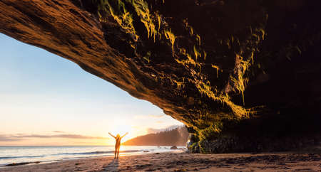 Adventurous Woman at Mystic Beach on the West Coast of Pacific Ocean. Summer Sunny Sunset. Canadian...