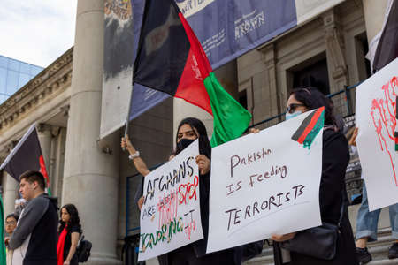 Downtown Vancouver, British Columbia, Canada - August 28, 2021: Crowd of people protesting against...