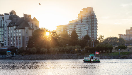 Victoria, Vancouver Island, British Columbia, Canada - August 18, 2021: Water Taxi in Downtown Victoria Harbour during sunny summer sunset.のeditorial素材
