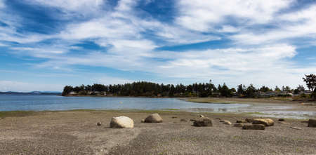 View of a scenic shore on the west coast of pacific ocean during a sunny summer day. Roberts Bay, Sidney, Vancouver Island, British Columbia, Canada.の写真素材