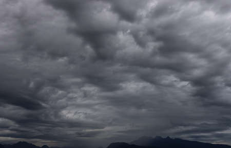 Dramatic Dark Cloudscape over Canadian Mountain Landscape. Taken in British Columbia, Canada.の写真素材