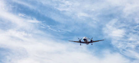 Victoria, Vancouver Island, British Columbia, Canada - August 25, 2021: Commercial Airliner airplane landing at the Airport during a sunny summer day.のeditorial素材